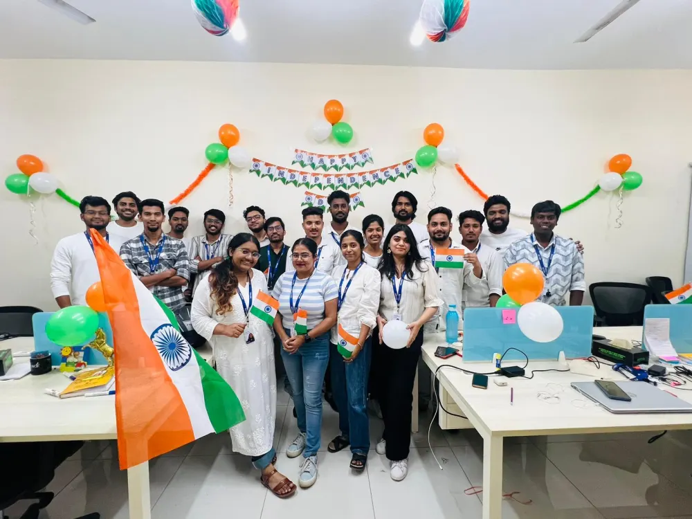 Zethic team with tricolour balloons and flags at the office on Independence Day